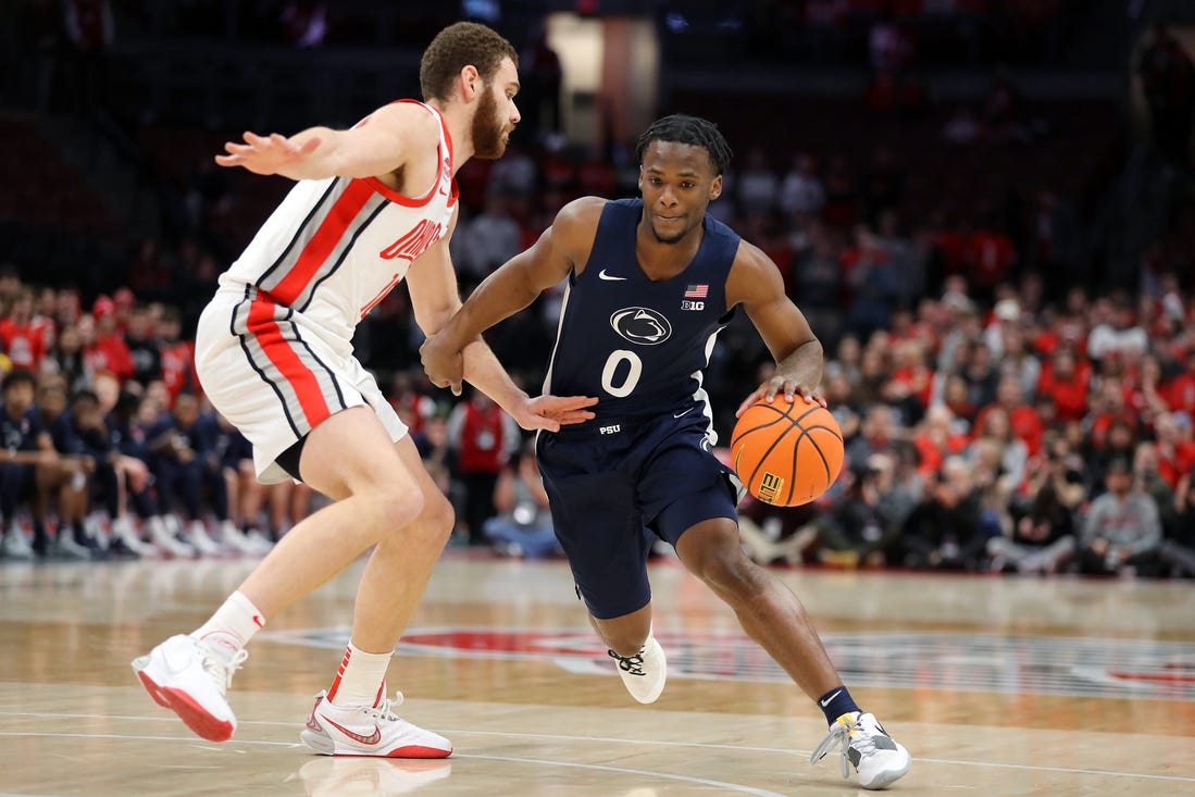 Jan 20, 2024; Columbus, Ohio, USA;  Penn State Nittany Lions guard Kanye Clary (0) controls the ball  as Ohio State Buckeyes forward Jamison Battle (10) defends during the first half at Value City Arena. Mandatory Credit: Joseph Maiorana-USA TODAY Sports