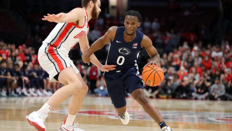 Jan 20, 2024; Columbus, Ohio, USA;  Penn State Nittany Lions guard Kanye Clary (0) controls the ball  as Ohio State Buckeyes forward Jamison Battle (10) defends during the first half at Value City Arena. Mandatory Credit: Joseph Maiorana-USA TODAY Sports