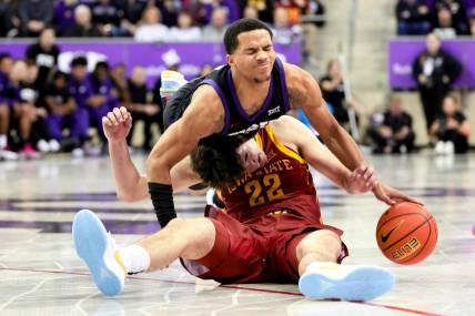 Jan 20, 2024; Fort Worth, Texas, USA;  TCU Horned Frogs guard Jameer Nelson Jr. (4) and Iowa State Cyclones forward Milan Momcilovic (22) go for a loose ball during the second half at Ed and Rae Schollmaier Arena. Mandatory Credit: Kevin Jairaj-USA TODAY Sports