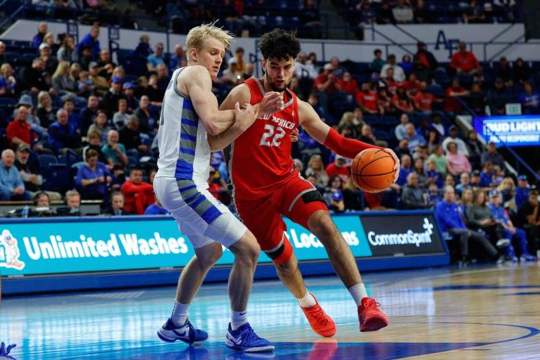 Jan 20, 2024; Colorado Springs, Colorado, USA; New Mexico Lobos forward Mustapha Amzil (22) drives to the basket against Air Force Falcons forward Rytis Petraitis (31) in the second half at Clune Arena. Mandatory Credit: Isaiah J. Downing-USA TODAY Sports