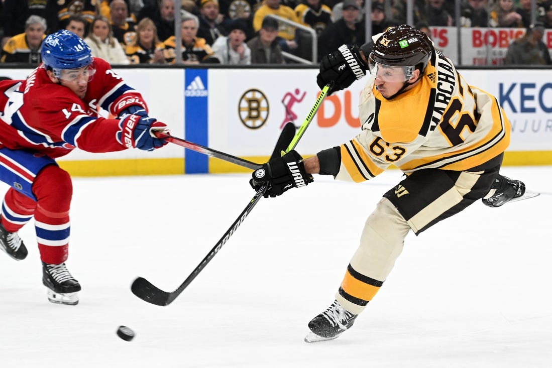 Jan 20, 2024; Boston, Massachusetts, USA; Boston Bruins left wing Brad Marchand (63) takes a shot against the Montreal Canadiens during the first period at the TD Garden. Mandatory Credit: Brian Fluharty-USA TODAY Sports