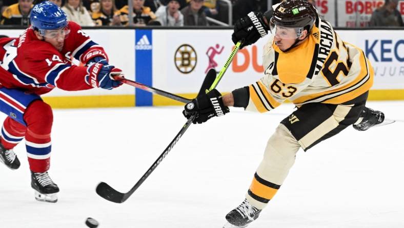 Jan 20, 2024; Boston, Massachusetts, USA; Boston Bruins left wing Brad Marchand (63) takes a shot against the Montreal Canadiens during the first period at the TD Garden. Mandatory Credit: Brian Fluharty-USA TODAY Sports