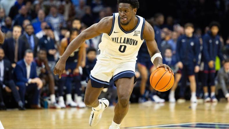 Jan 20, 2024; Philadelphia, Pennsylvania, USA; Villanova Wildcats guard TJ Bamba (0) dribbles the ball against the Connecticut Huskies during the second half at Wells Fargo Center. Mandatory Credit: Bill Streicher-USA TODAY Sports