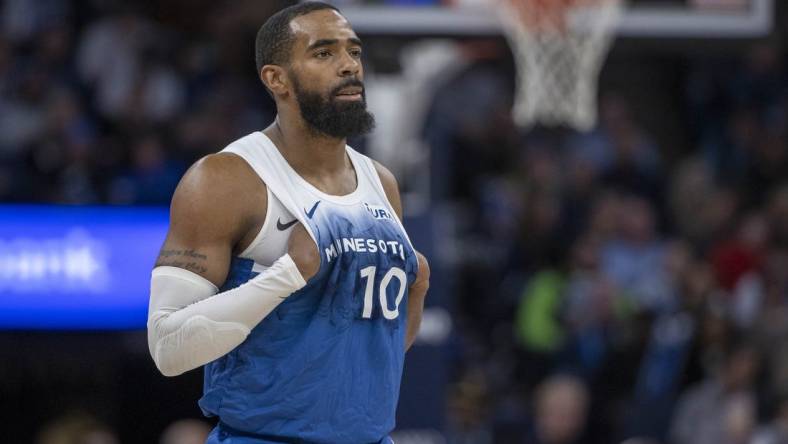 Jan 20, 2024; Minneapolis, Minnesota, USA; Minnesota Timberwolves guard Mike Conley (10) looks on against the Oklahoma City Thunder in the second half at Target Center. Mandatory Credit: Jesse Johnson-USA TODAY Sports