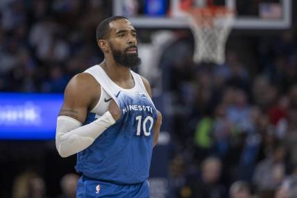 Jan 20, 2024; Minneapolis, Minnesota, USA; Minnesota Timberwolves guard Mike Conley (10) looks on against the Oklahoma City Thunder in the second half at Target Center. Mandatory Credit: Jesse Johnson-USA TODAY Sports