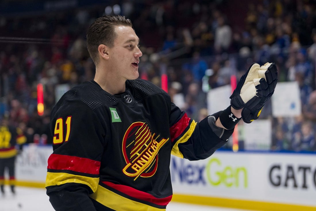 Jan 22, 2024; Vancouver, British Columbia, CAN; Vancouver Canucks defenseman Nikita Zadorov (91) waves to the fans during warm up prior to a game against the Chicago Blackhawks at Rogers Arena. Mandatory Credit: Bob Frid-USA TODAY Sports