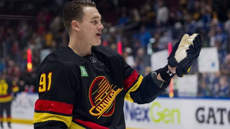 Jan 22, 2024; Vancouver, British Columbia, CAN; Vancouver Canucks defenseman Nikita Zadorov (91) waves to the fans during warm up prior to a game against the Chicago Blackhawks at Rogers Arena. Mandatory Credit: Bob Frid-USA TODAY Sports