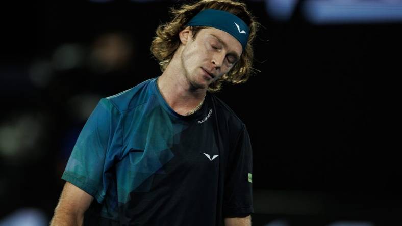 Jan 23, 2024; Melbourne, Victoria, Australia;  
Andrey Rublev of Russia reacts during his match against Jannik Sinner of Italy in the quarter final of the men s singles. Mandatory Credit: Mike Frey-USA TODAY Sports