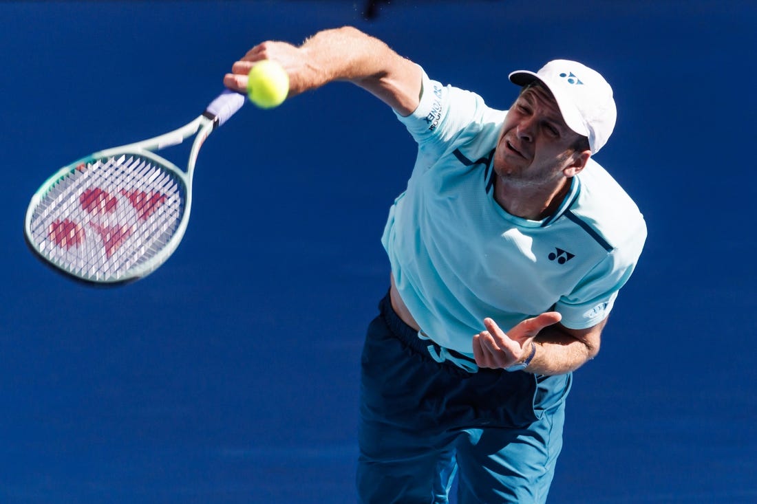 Jan 24, 2024; Melbourne, Victoria, Australia;  
Hubert Hurkacz of Poland in action against Daniil Medvedev of Russia in the quarter final of the men   s singles at the Australian Open.
Mandatory Credit: Mike Frey-USA TODAY Sports