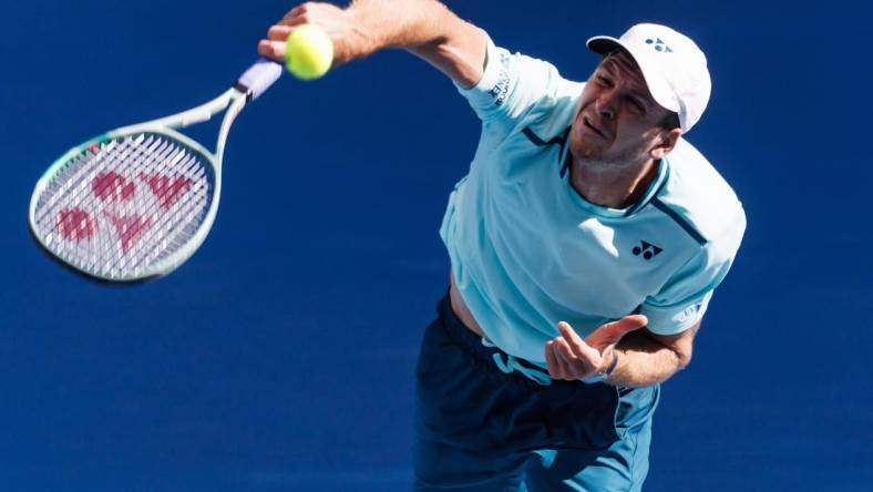 Jan 24, 2024; Melbourne, Victoria, Australia;  
Hubert Hurkacz of Poland in action against Daniil Medvedev of Russia in the quarter final of the men   s singles at the Australian Open.
Mandatory Credit: Mike Frey-USA TODAY Sports