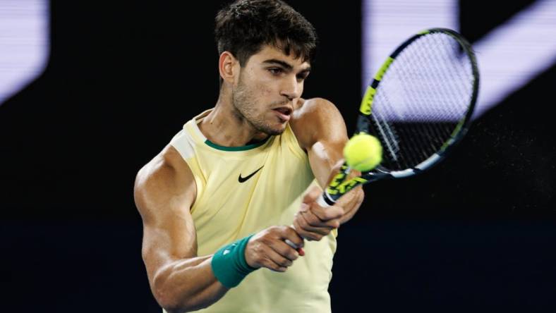 Jan 24, 2024; Melbourne, Victoria, Australia; 
Carlos Alcaraz of Spain in action against Alexander Zverev of Germany in the quarter final of the men s singles at the Australian Open. Mandatory Credit: Mike Frey-USA TODAY Sports