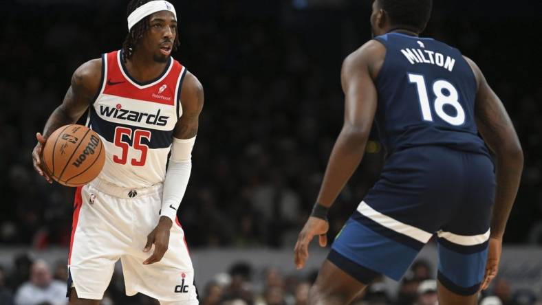 Jan 24, 2024; Washington, District of Columbia, USA; Washington Wizards guard Delon Wright (55) looks to pass as Minnesota Timberwolves guard Shake Milton (18) defends  during the second half at Capital One Arena. Mandatory Credit: Tommy Gilligan-USA TODAY Sports