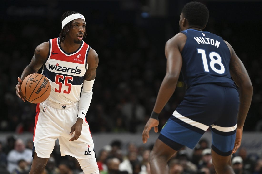 Jan 24, 2024; Washington, District of Columbia, USA; Washington Wizards guard Delon Wright (55) looks to pass as Minnesota Timberwolves guard Shake Milton (18) defends  during the second half at Capital One Arena. Mandatory Credit: Tommy Gilligan-USA TODAY Sports