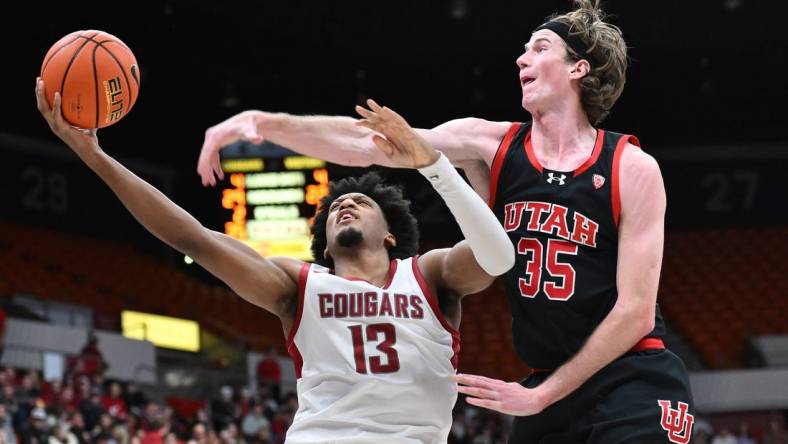 Jan 24, 2024; Pullman, Washington, USA; Washington State Cougars forward Isaac Jones (13) shoots the ball against Utah Utes center Branden Carlson (35) in the second half at Friel Court at Beasley Coliseum. Washington State won 79-57. Mandatory Credit: James Snook-USA TODAY Sports