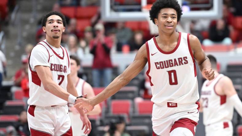 Jan 24, 2024; Pullman, Washington, USA; Washington State Cougars forward Jaylen Wells (0) celebrates a three-pointer during a game against the Utah Utes in the second half at Friel Court at Beasley Coliseum. Washington State won 79-57. Mandatory Credit: James Snook-USA TODAY Sports