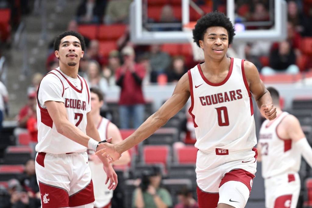 Jan 24, 2024; Pullman, Washington, USA; Washington State Cougars forward Jaylen Wells (0) celebrates a three-pointer during a game against the Utah Utes in the second half at Friel Court at Beasley Coliseum. Washington State won 79-57. Mandatory Credit: James Snook-USA TODAY Sports