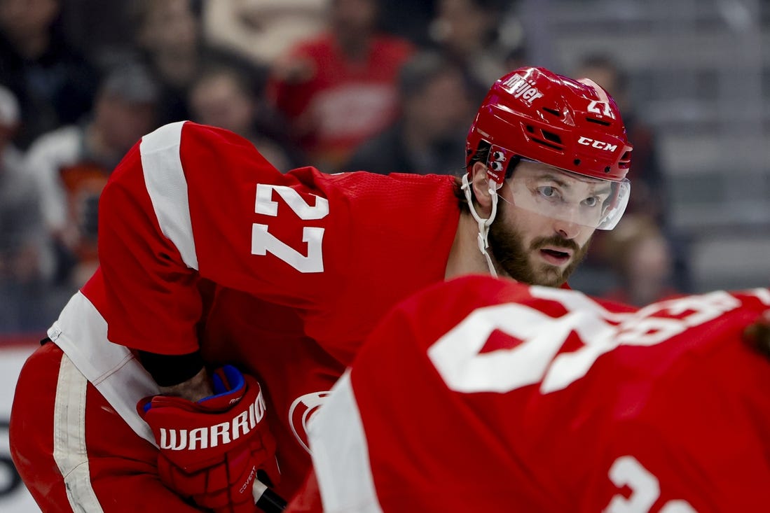 Jan 25, 2024; Detroit, Michigan, USA;  Detroit Red Wings center Michael Rasmussen (27) gets set during a face off in the first period against the Philadelphia Flyers at Little Caesars Arena. Mandatory Credit: Rick Osentoski-USA TODAY Sports