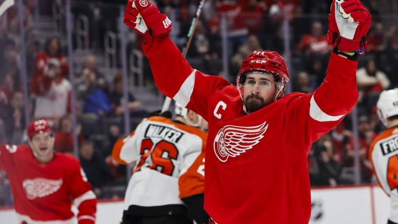 Jan 25, 2024; Detroit, Michigan, USA;  Detroit Red Wings center Dylan Larkin (71) celebrates after he score a goal in the second period against the Philadelphia Flyers at Little Caesars Arena. Mandatory Credit: Rick Osentoski-USA TODAY Sports