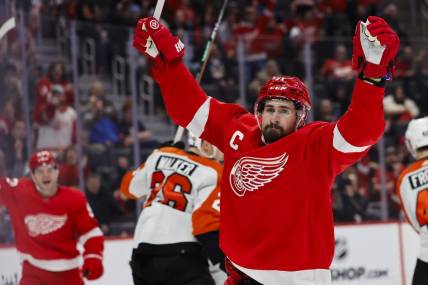 Jan 25, 2024; Detroit, Michigan, USA;  Detroit Red Wings center Dylan Larkin (71) celebrates after he score a goal in the second period against the Philadelphia Flyers at Little Caesars Arena. Mandatory Credit: Rick Osentoski-USA TODAY Sports