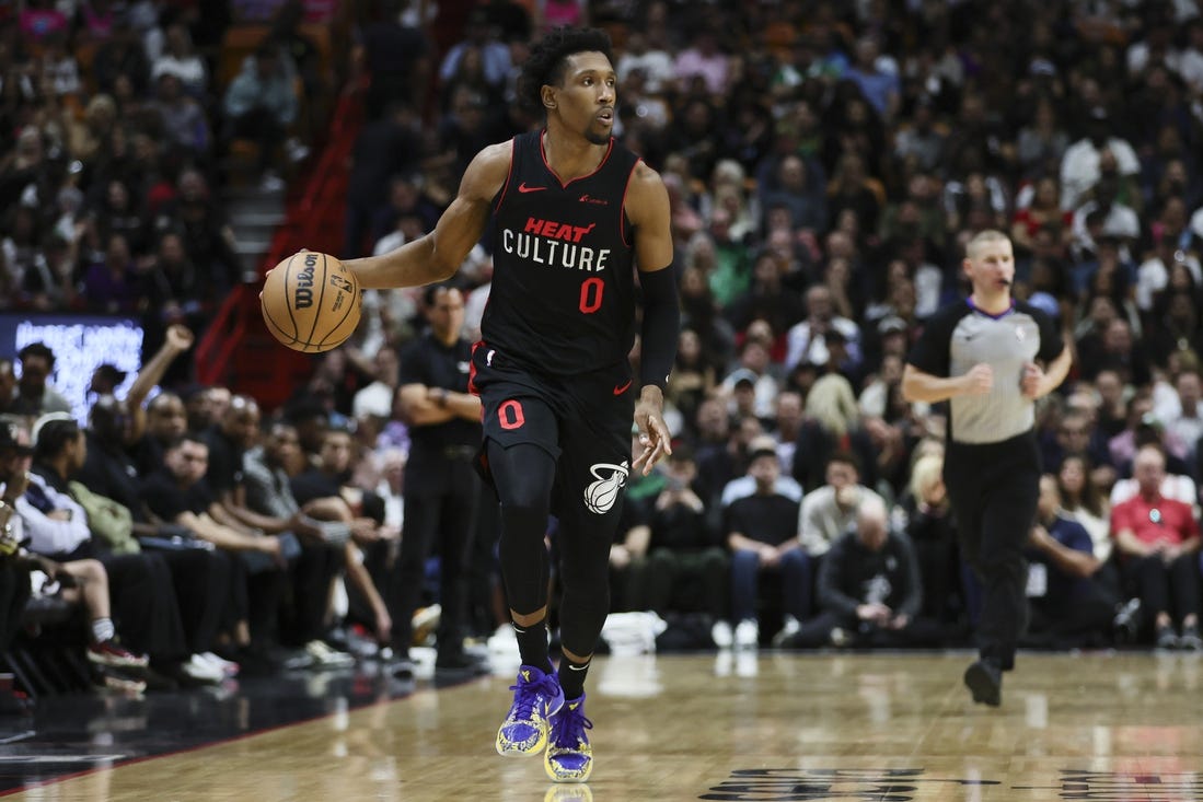 Jan 25, 2024; Miami, Florida, USA; Miami Heat guard Josh Richardson (0) dribbles the basketball against the Boston Celtics during the third quarter at Kaseya Center. Mandatory Credit: Sam Navarro-USA TODAY Sports