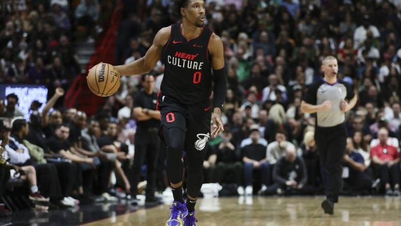 Jan 25, 2024; Miami, Florida, USA; Miami Heat guard Josh Richardson (0) dribbles the basketball against the Boston Celtics during the third quarter at Kaseya Center. Mandatory Credit: Sam Navarro-USA TODAY Sports