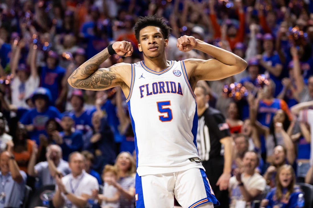 Jan 27, 2024; Gainesville, Florida, USA; Florida Gators guard Will Richard (5) gestures after a score against the Georgia Bulldogs during the second half at Exactech Arena at the Stephen C. O