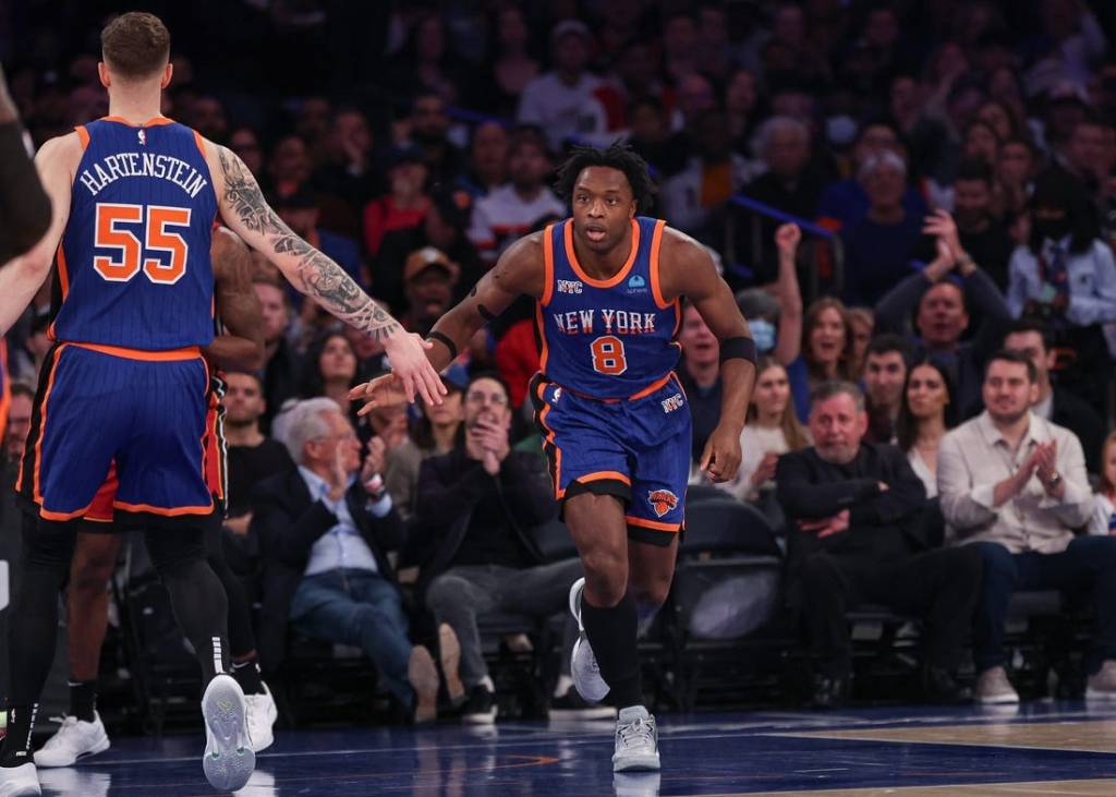 Jan 27, 2024; New York, New York, USA; New York Knicks forward OG Anunoby (8) slaps hands with center Isaiah Hartenstein (55) after a basket against the Miami Heat during the first half at Madison Square Garden. Mandatory Credit: Vincent Carchietta-USA TODAY Sports