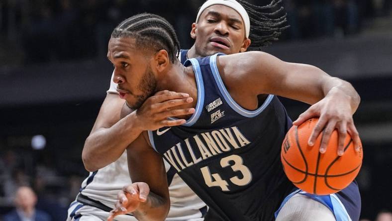 Villanova Wildcats forward Eric Dixon (43) rushes up the court Butler Bulldogs forward Jalen Thomas (1) on Saturday, Jan. 27, 2024, during the game at Hinkle Fieldhouse in Indianapolis.