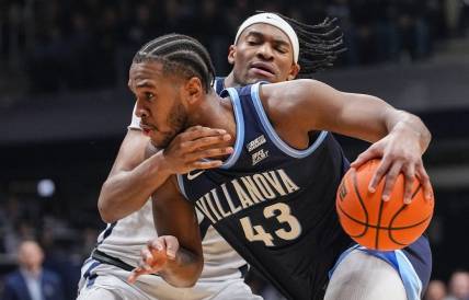 Villanova Wildcats forward Eric Dixon (43) rushes up the court Butler Bulldogs forward Jalen Thomas (1) on Saturday, Jan. 27, 2024, during the game at Hinkle Fieldhouse in Indianapolis.