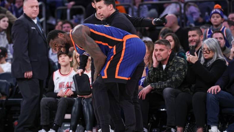 Jan 27, 2024; New York, New York, USA; New York Knicks forward Julius Randle (30) is helped by medical staff after an injury during the second half against the Miami Heat at Madison Square Garden. Mandatory Credit: Vincent Carchietta-USA TODAY Sports