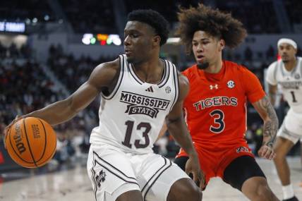 Jan 27, 2024; Starkville, Mississippi, USA; Mississippi State Bulldogs guard Josh Hubbard (13) dribbles as Auburn Tigers guard Tre Donaldson (3) defends during the second half at Humphrey Coliseum. Mandatory Credit: Petre Thomas-USA TODAY Sports