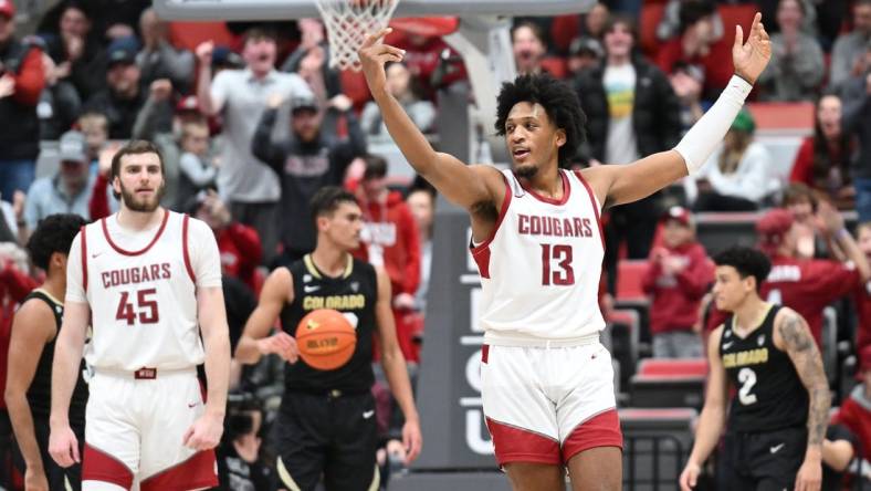 Jan 27, 2024; Pullman, Washington, USA; Washington State Cougars forward Isaac Jones (13) celebrates after a play against the Colorado Buffaloes in the second half at Friel Court at Beasley Coliseum. Washington State won 78-69. Mandatory Credit: James Snook-USA TODAY Sports