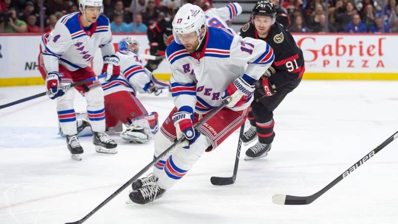 Jan 27, 2024; Ottawa, Ontario, CAN; New York Rangers right wing Blake Wheeler (17) skates with the puck in the first period against the Ottawa Senators at the Canadian Tire Centre. Mandatory Credit: Marc DesRosiers-USA TODAY Sports