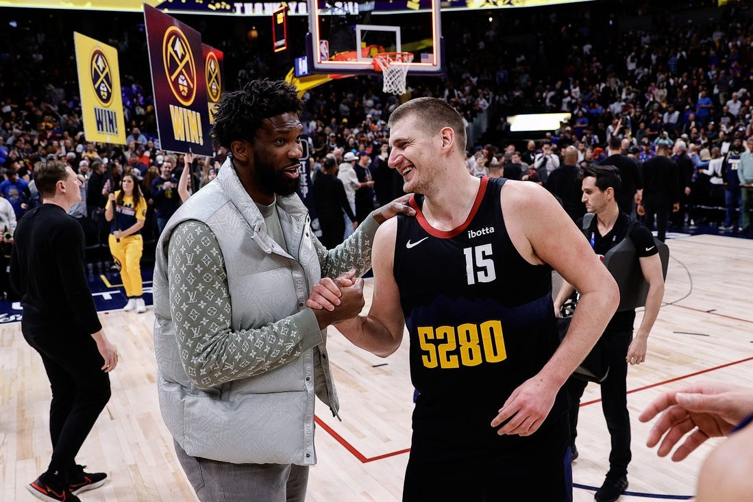 Jan 27, 2024; Denver, Colorado, USA; Philadelphia 76ers center Joel Embiid (21) and Denver Nuggets center Nikola Jokic (15) after the game at Ball Arena. Mandatory Credit: Isaiah J. Downing-USA TODAY Sports