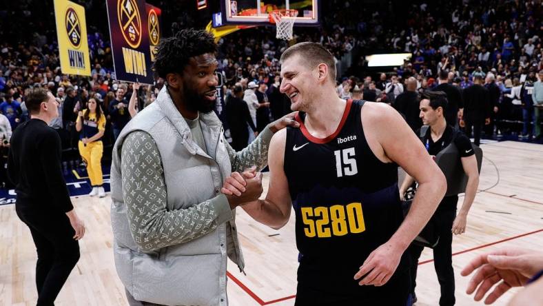 Jan 27, 2024; Denver, Colorado, USA; Philadelphia 76ers center Joel Embiid (21) and Denver Nuggets center Nikola Jokic (15) after the game at Ball Arena. Mandatory Credit: Isaiah J. Downing-USA TODAY Sports