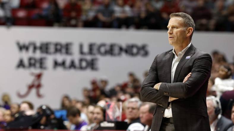 Jan 27, 2024; Tuscaloosa, Alabama, USA;  Alabama Crimson Tide head coach Nate Oats watches during the first half against the LSU Tigers at Coleman Coliseum. Mandatory Credit: Butch Dill-USA TODAY Sports