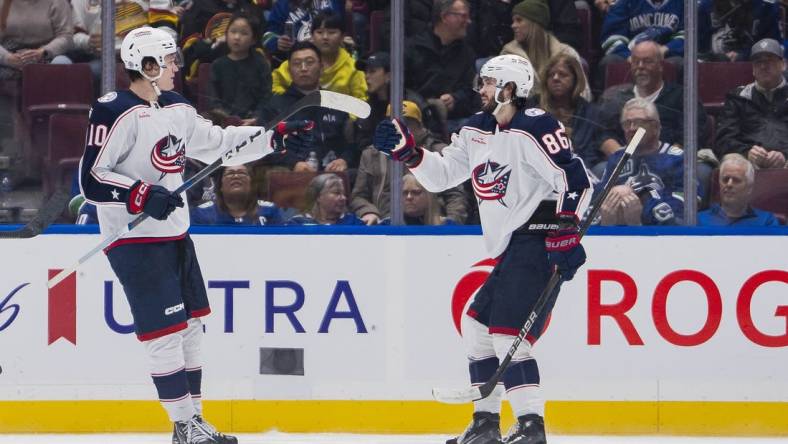 Jan 27, 2024; Vancouver, British Columbia, CAN; Columbus Blue Jackets forward Dmitri Voronkov (10) and forward Kirill Marchenko (86) celebrate Marchenko   s goal against the Vancouver Canucks in the second period at Rogers Arena. Mandatory Credit: Bob Frid-USA TODAY Sports