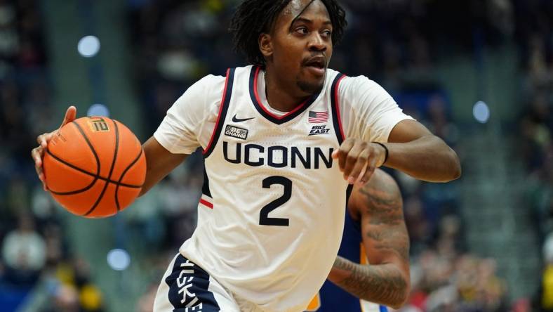 Jan 28, 2024; Hartford, Connecticut, USA; UConn Huskies guard Tristen Newton (2) drives the ball against the Xavier Musketeers in the first half at XL Center. Mandatory Credit: David Butler II-USA TODAY Sports