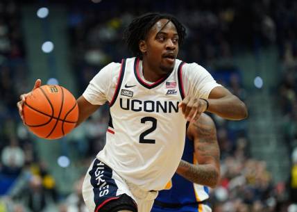 Jan 28, 2024; Hartford, Connecticut, USA; UConn Huskies guard Tristen Newton (2) drives the ball against the Xavier Musketeers in the first half at XL Center. Mandatory Credit: David Butler II-USA TODAY Sports