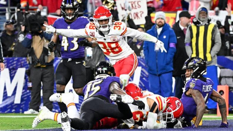 Jan 28, 2024; Baltimore, Maryland, USA; Kansas City Chiefs cornerback L'Jarius Sneed (38) celebrates as cornerback Trent McDuffie (22) recovers a fumble against Baltimore Ravens wide receiver Zay Flowers (4) and wide receiver Nelson Agholor (15) for a turnover during the second half in the AFC Championship football game at M&T Bank Stadium. Mandatory Credit: Tommy Gilligan-USA TODAY Sports