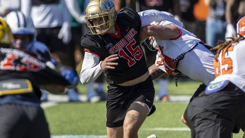 At the Senior Bowl, defensive end Laiatu Latu of UCLA (15) attempted to solidify his pre-draft status as a first-round talent. Mandatory Credit: Vasha Hunt-USA TODAY Sports