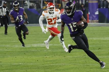 Jan 28, 2024; Baltimore, Maryland, USA; Baltimore Ravens wide receiver Nelson Agholor (15) runs with the ball against the Kansas City Chiefs in the AFC Championship football game at M&T Bank Stadium. Mandatory Credit: Geoff Burke-USA TODAY Sports