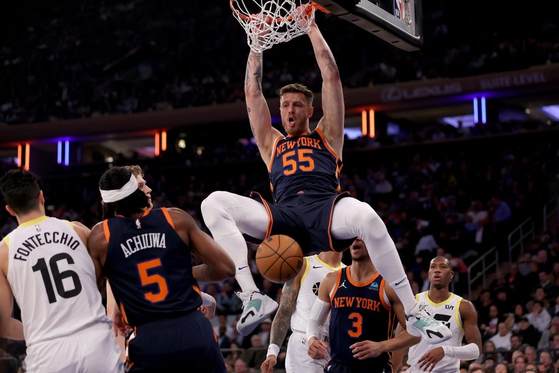 Jan 30, 2024; New York, New York, USA; New York Knicks center Isaiah Hartenstein (55) dunks against Utah Jazz forwards Simone Fontecchio (16) and Lauri Markkanen (23) and John Collins (20) and guard Kris Dunn (11) during the first quarter at Madison Square Garden. Mandatory Credit: Brad Penner-USA TODAY Sports