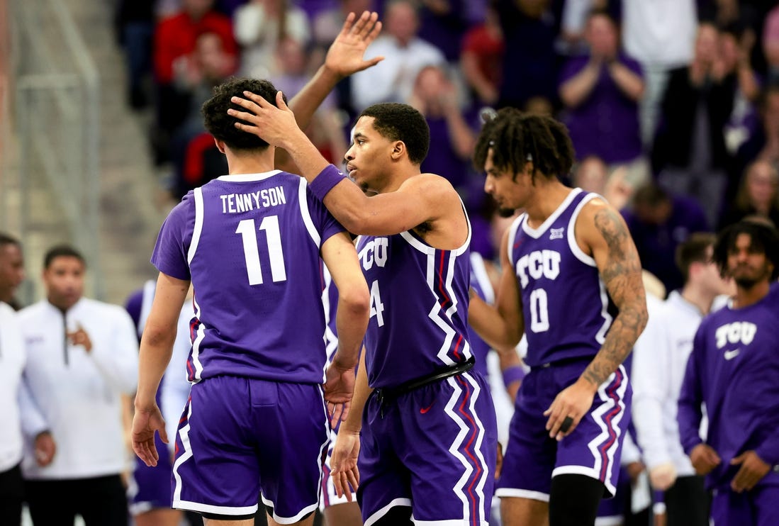 Jan 30, 2024; Fort Worth, Texas, USA;  TCU Horned Frogs guard Trevian Tennyson (11) celebrates with TCU Horned Frogs guard Jameer Nelson Jr. (4) and TCU Horned Frogs guard Micah Peavy (0) during the second half against the Texas Tech Red Raiders at Ed and Rae Schollmaier Arena. Mandatory Credit: Kevin Jairaj-USA TODAY Sports