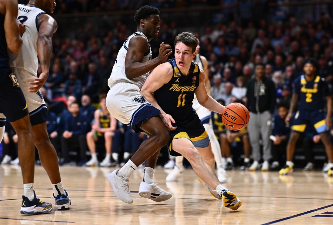 Jan 30, 2024; Villanova, Pennsylvania, USA; Marquette Golden Eagles guard Tyler Kolek (11) drives against Villanova Wildcats guard TJ Bamba (0) in the second half at William B. Finneran Pavilion. Mandatory Credit: Kyle Ross-USA TODAY Sports