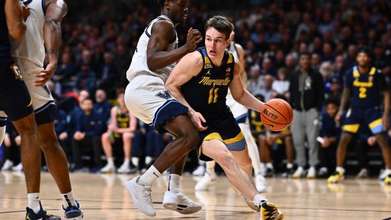 Jan 30, 2024; Villanova, Pennsylvania, USA; Marquette Golden Eagles guard Tyler Kolek (11) drives against Villanova Wildcats guard TJ Bamba (0) in the second half at William B. Finneran Pavilion. Mandatory Credit: Kyle Ross-USA TODAY Sports