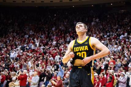 Jan 30, 2024; Bloomington, Indiana, USA; Iowa Hawkeyes forward Payton Sandfort (20) reacts to the loss against the Indiana Hoosiers  at Simon Skjodt Assembly Hall. Mandatory Credit: Trevor Ruszkowski-USA TODAY Sports
