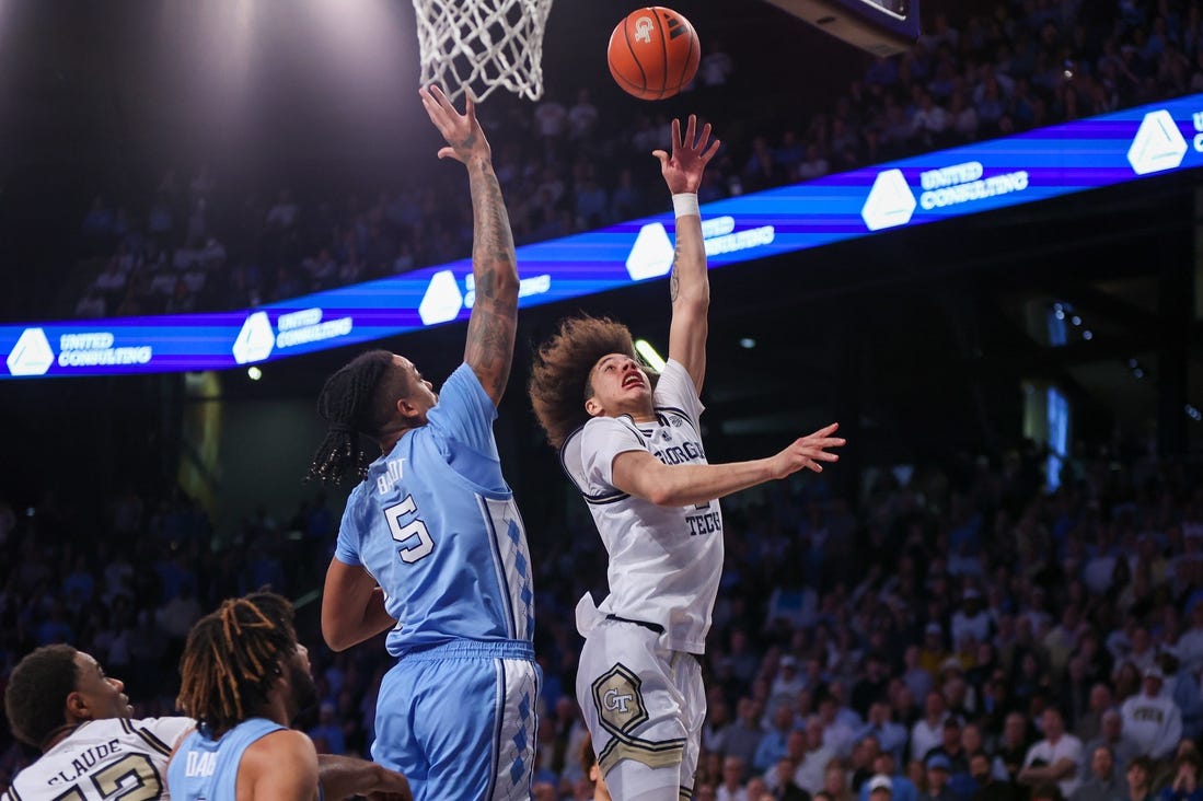 Jan 30, 2024; Atlanta, Georgia, USA; Georgia Tech Yellow Jackets guard Naithan George (2) shoots over North Carolina Tar Heels forward Armando Bacot (5) in the second half at McCamish Pavilion. Mandatory Credit: Brett Davis-USA TODAY Sports