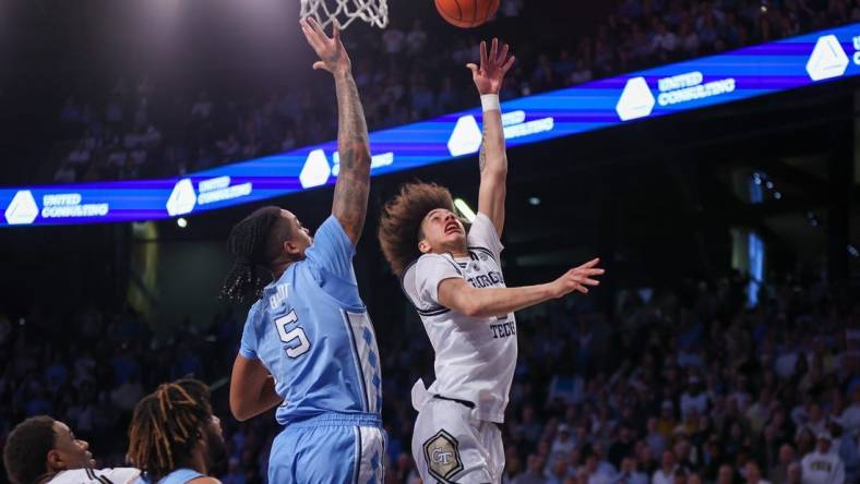 Jan 30, 2024; Atlanta, Georgia, USA; Georgia Tech Yellow Jackets guard Naithan George (2) shoots over North Carolina Tar Heels forward Armando Bacot (5) in the second half at McCamish Pavilion. Mandatory Credit: Brett Davis-USA TODAY Sports