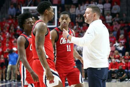 Jan 30, 2024; Oxford, Mississippi, USA; Mississippi Rebels head coach Chris Beard huddles his team near the end of the second half against the Mississippi State Bulldogs at The Sandy and John Black Pavilion at Ole Miss. Mandatory Credit: Petre Thomas-USA TODAY Sports